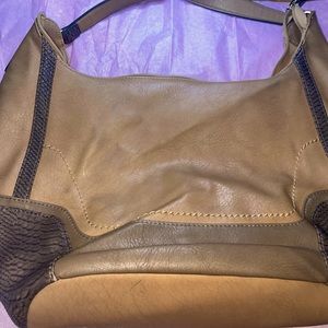 This is a brown-tan Louis Candy purse in healthy condition